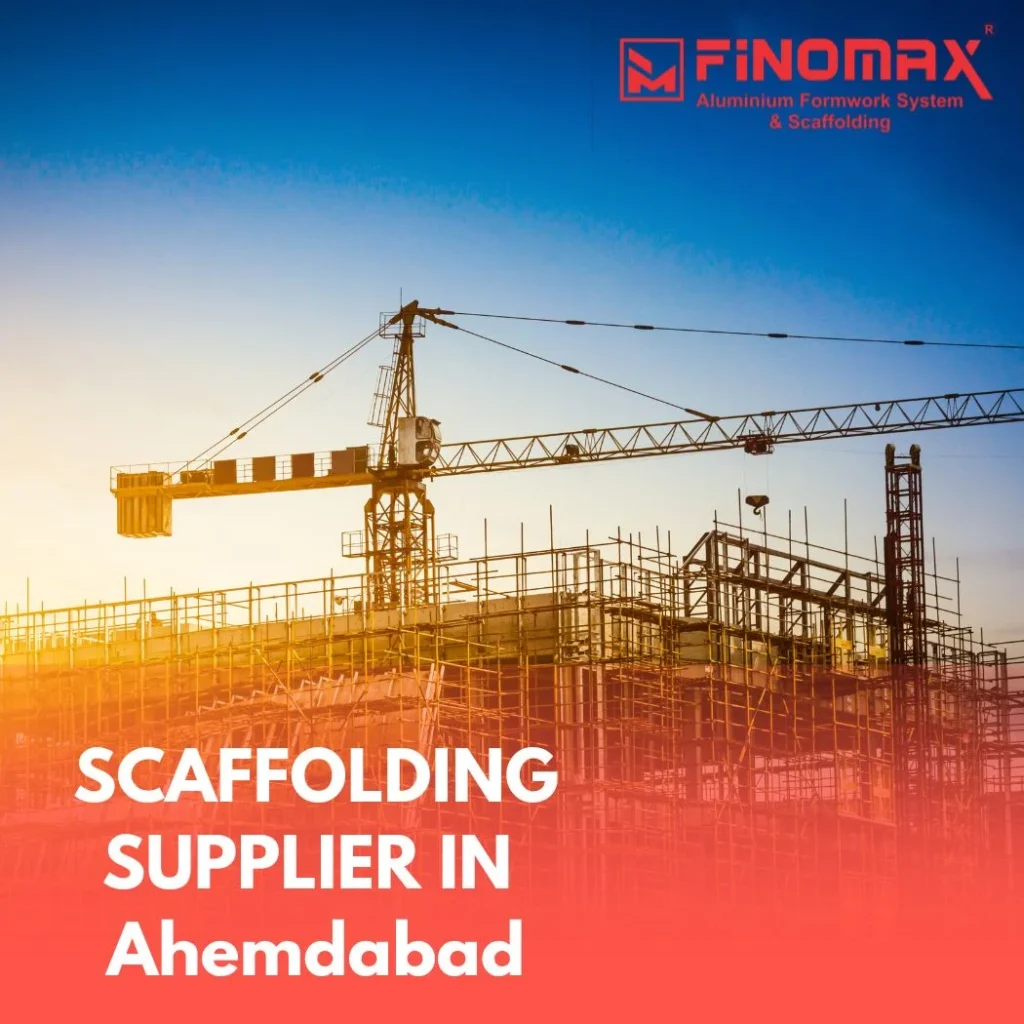 Scaffolding materials including cuplock systems and adjustable props stacked outside a supplier’s warehouse in Ahmedabad.